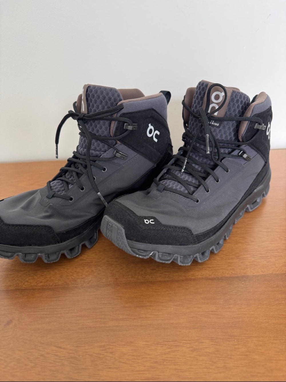 On Running Women's Lace-Up Mid-Top Boots in Black and Gray